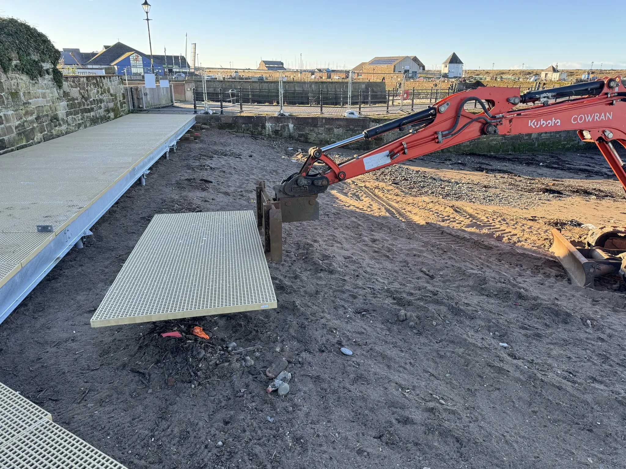 Custom non-slip GRP panels being installed on the Maryport Boardwalk