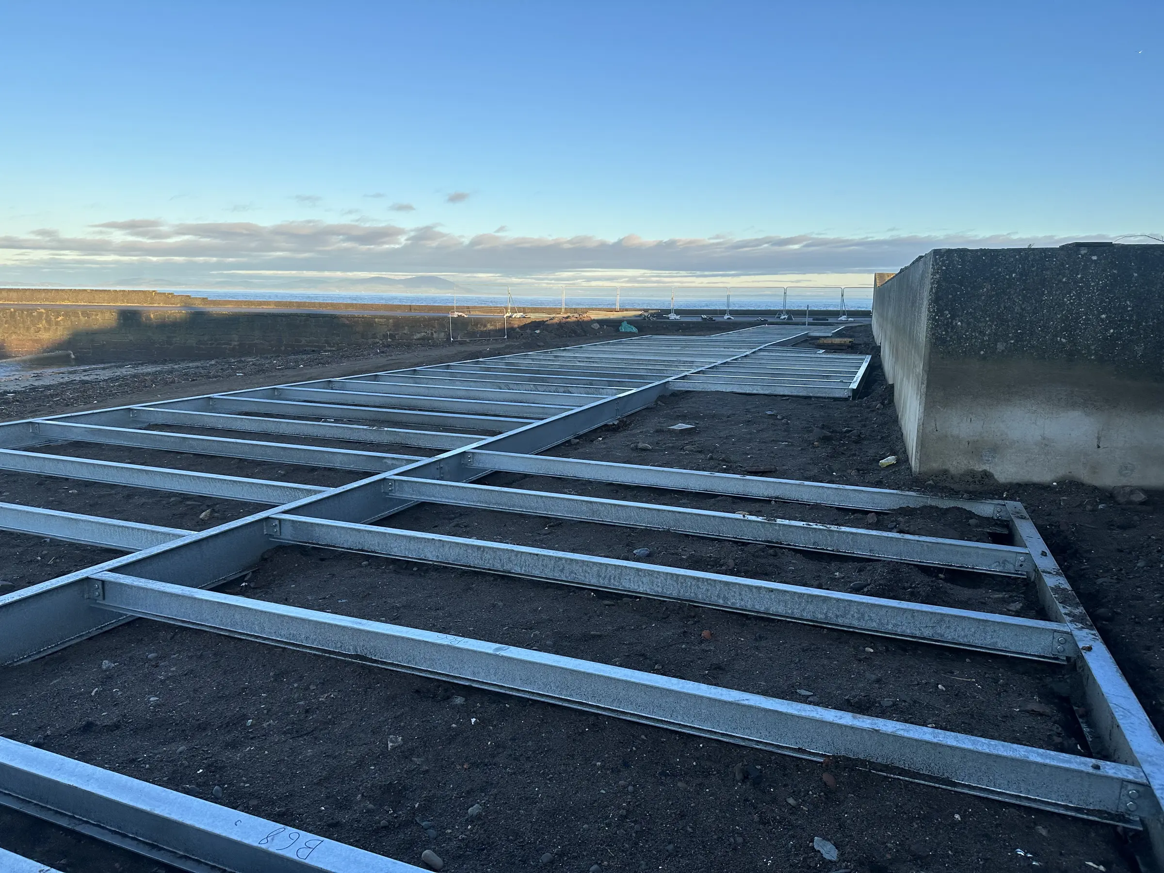 Galvanised structural steel frame installed across the tidal ground at Maryport