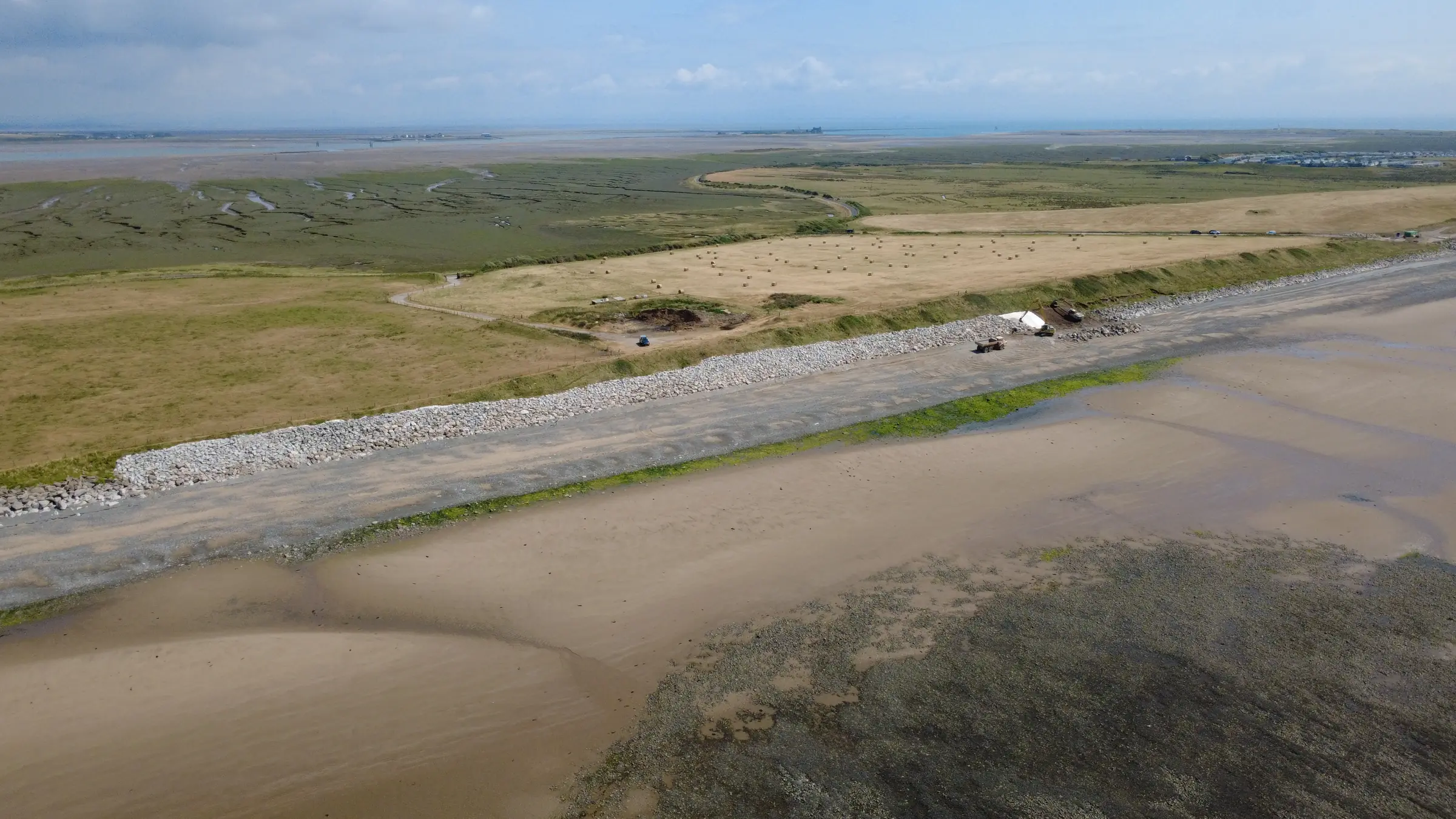 Aerial overview of Cowran Estate Services coastal defence extending along the South Walney shoreline beside the estuary