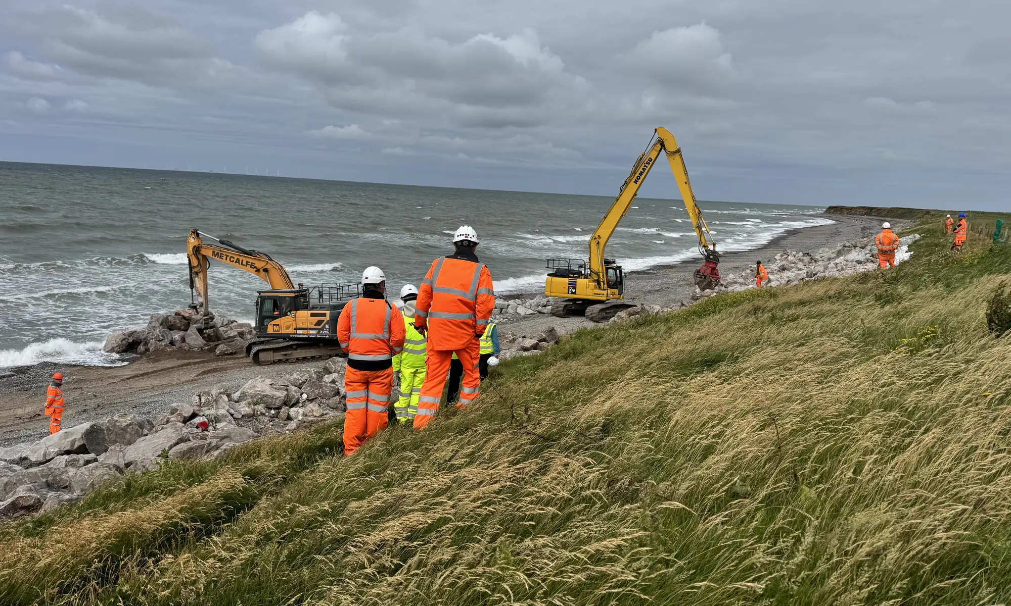 Cowran Estate Services team and excavators coordinating rock-armour coastal protection along the South Walney shoreline